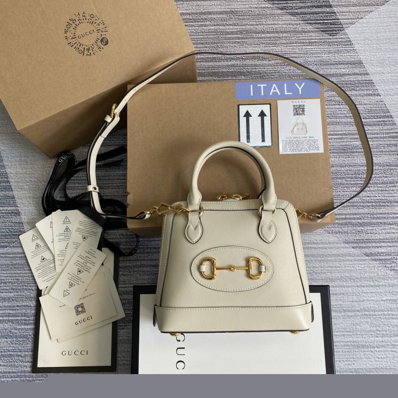 G*u*i top handle bags